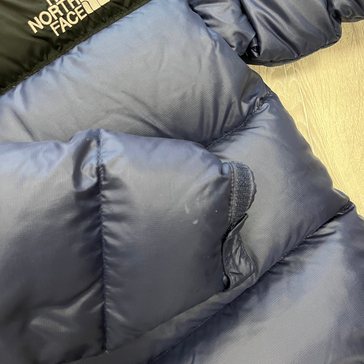 The North Face Navy Blue Puffer Jacket WITH STAIN & MINOR DAMAGE