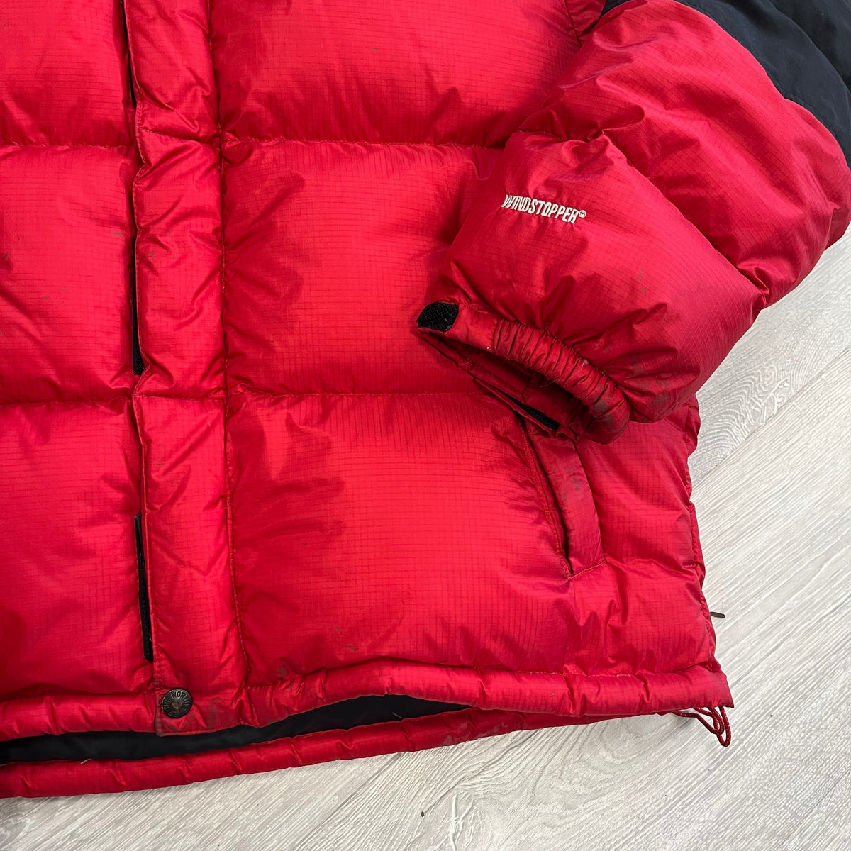 The North Face Red Baltoro Puffer Jacket WITH STAINS