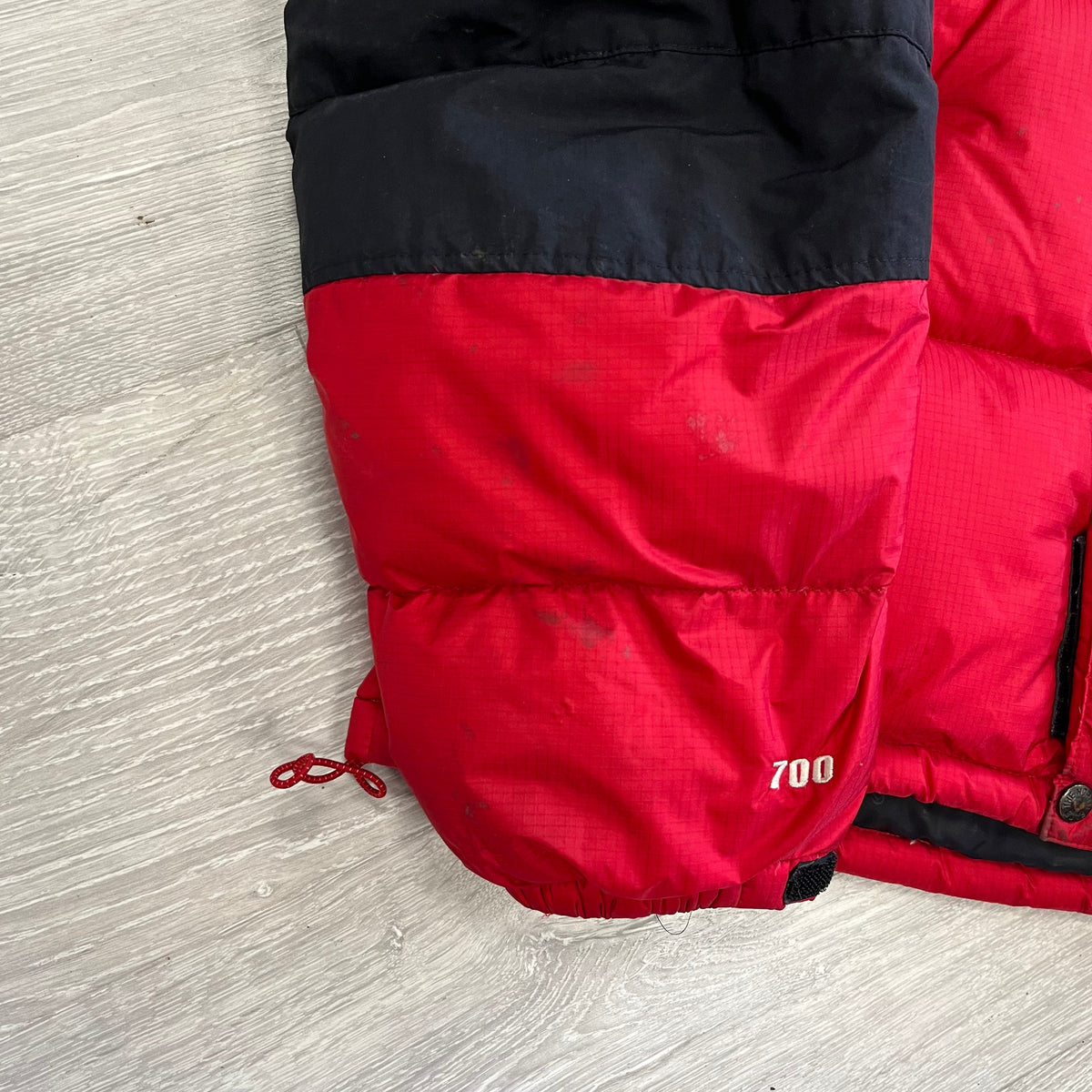 The North Face Red Baltoro Puffer Jacket WITH STAINS