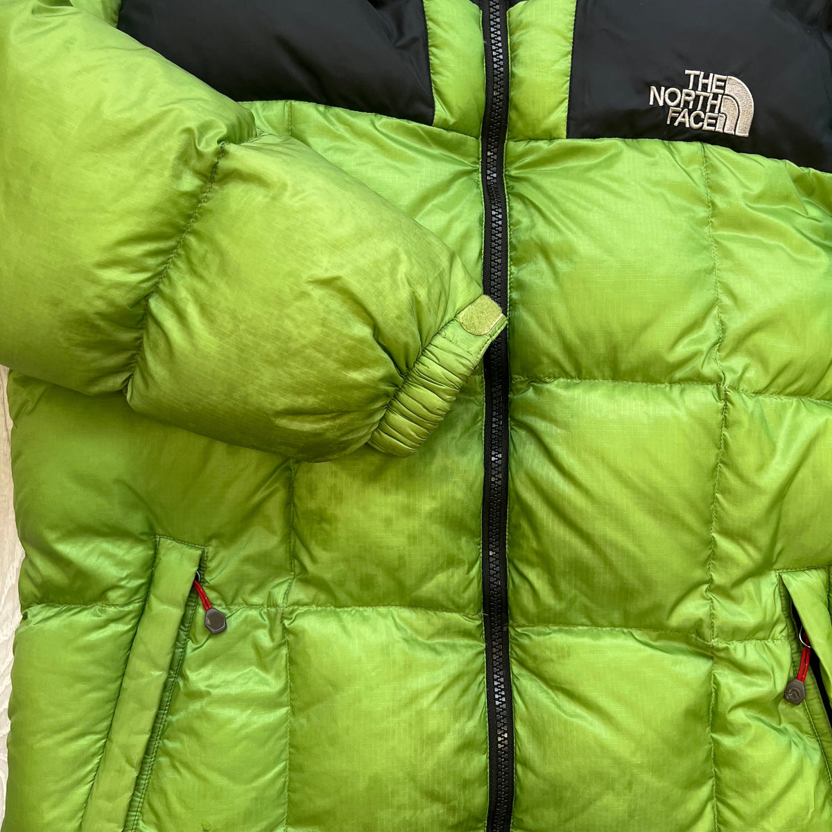 The North Face Green Lhotse Summit Series Puffer Jacket WITH STAIN
